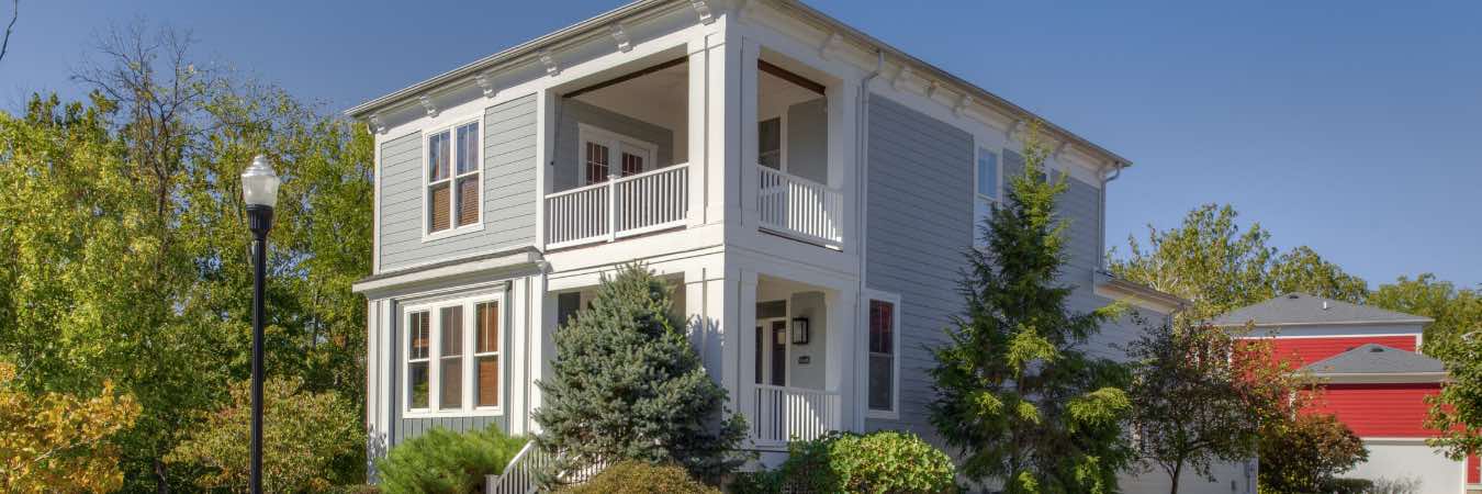 Two-story apartment building with balcony at City Flats at Renwick in Bloomington