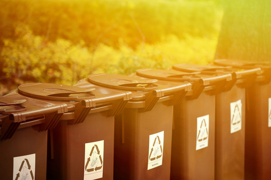 Row of recycling containers for tenants